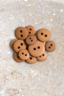 Another close-up of the buttons on the marbled beige stone, from a different angle.