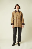 Barn Jacket pattern – front view, camel jacket burgundy velvet collar, matching buttons, black trousers – Atelier Brunette