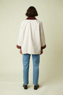 Barn Jacket pattern – back view, jacket off-white burgundy velvet collar, blue jeans – Atelier Brunette